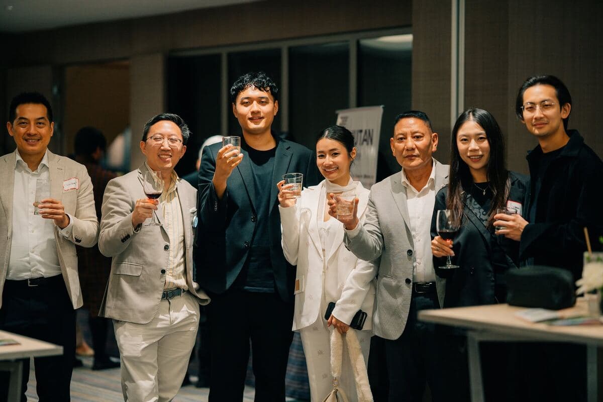 Guests toasting at a BHTCC gathering in Bangkok